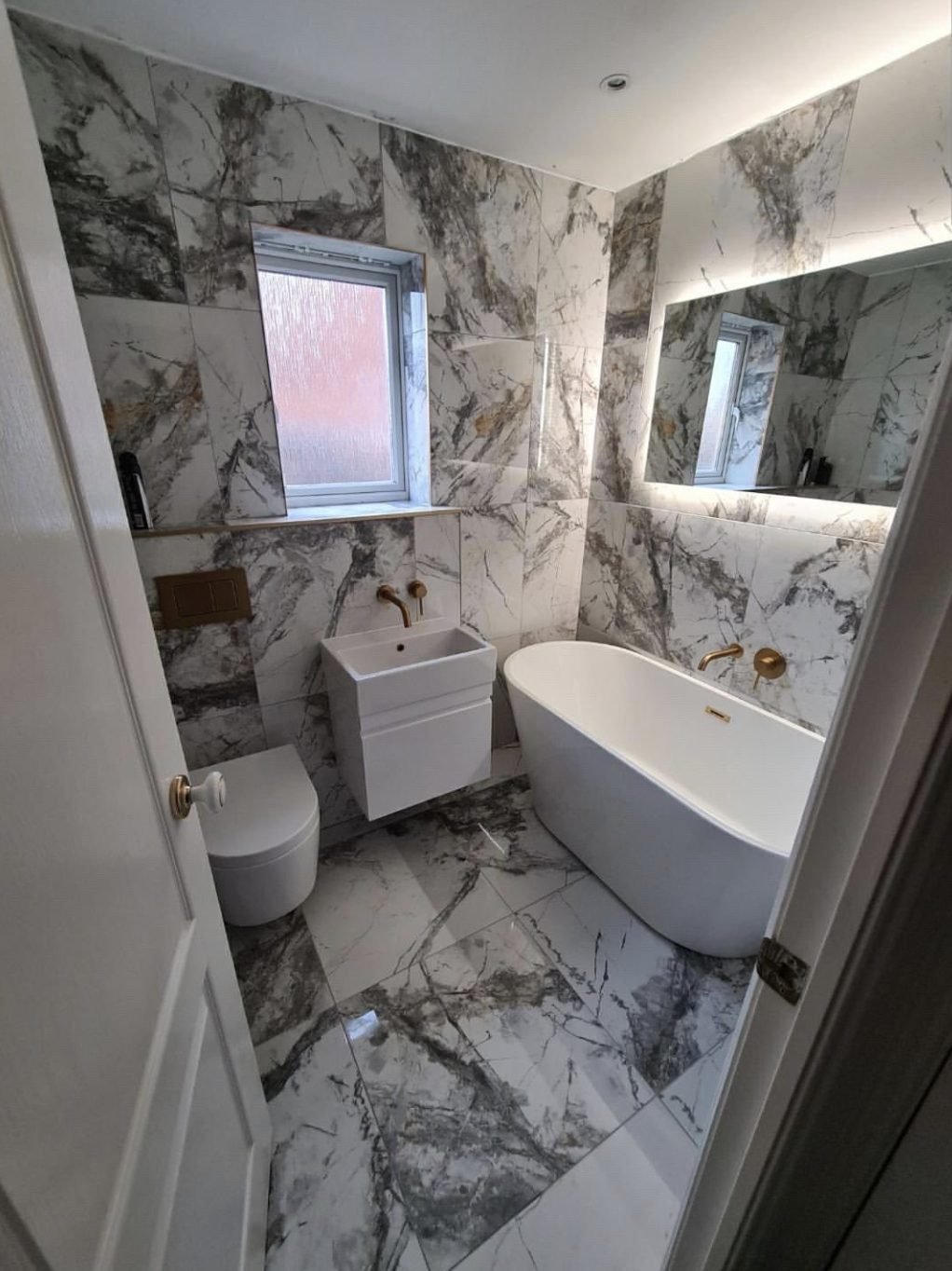 Bathroom installation Doncaster &mdash; marble tiled bathroom with freestanding bath